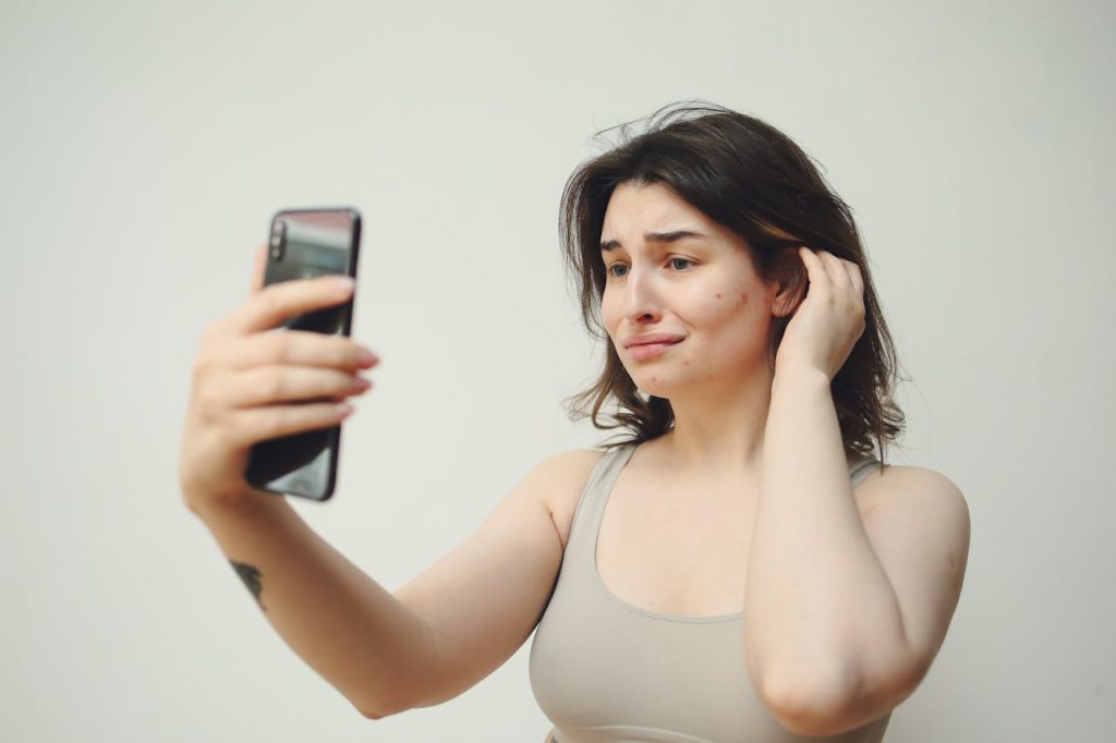 woman trying to figure out the causes of acne so she can get it treated